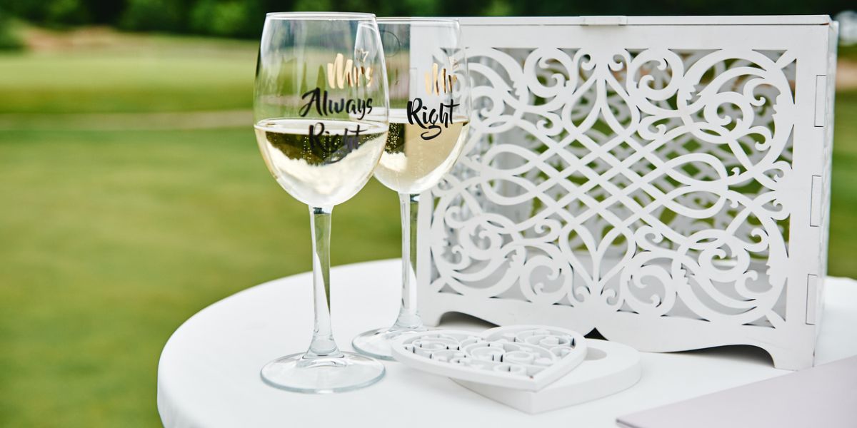 Sparkling wedding glasses with champagne on a golf course