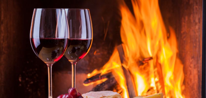 red wine by a warm fire